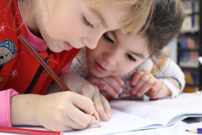 Two kids coloring