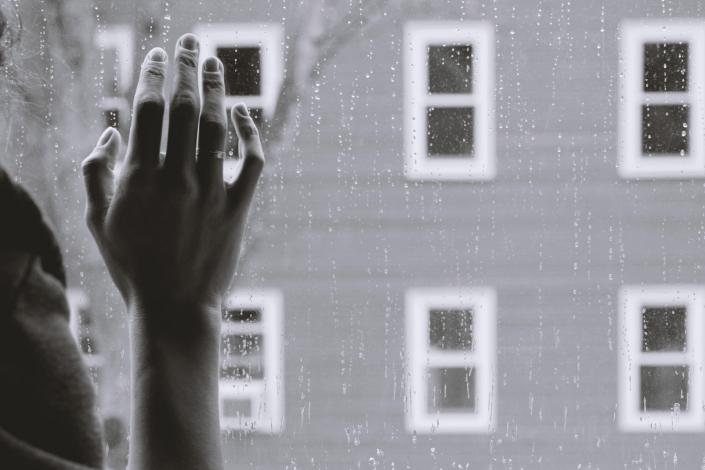 Woman's hand on window