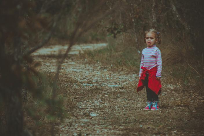 Girl crying on path