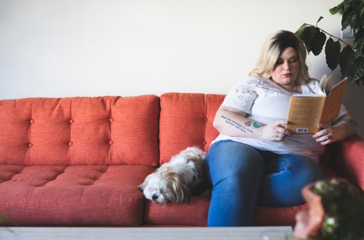 Woman reading on couch