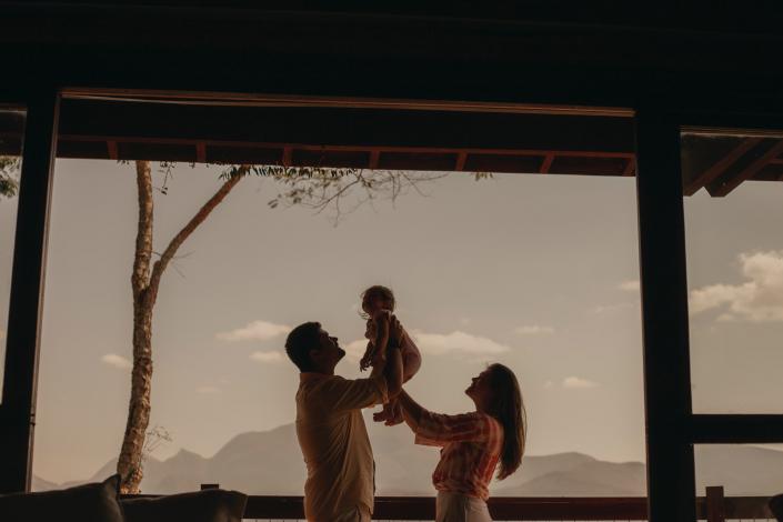 Parents holding their baby up