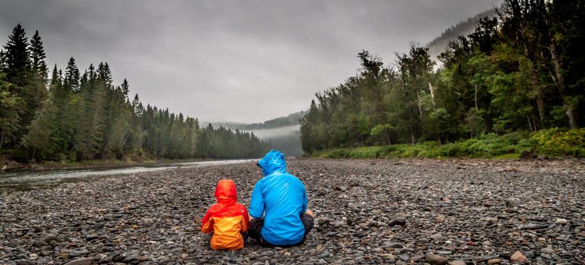 Parent and child sitting on the ground