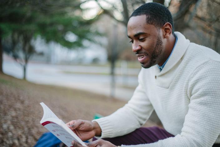 Man reading on a bench