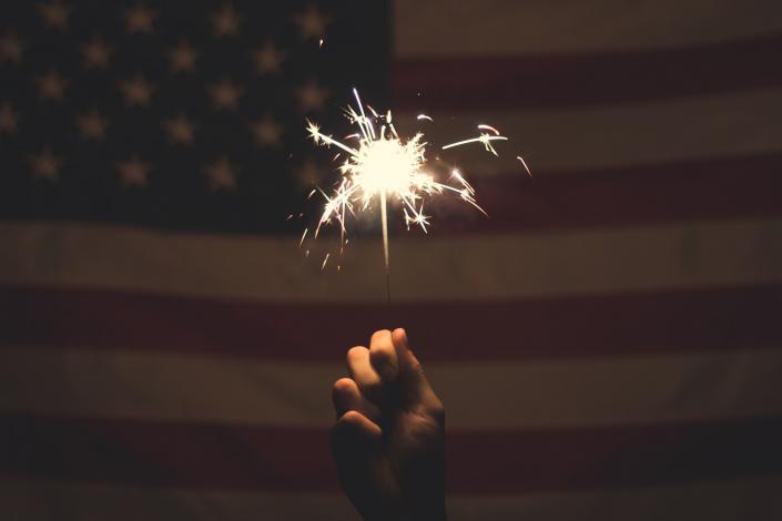 Sparkler in front of flag