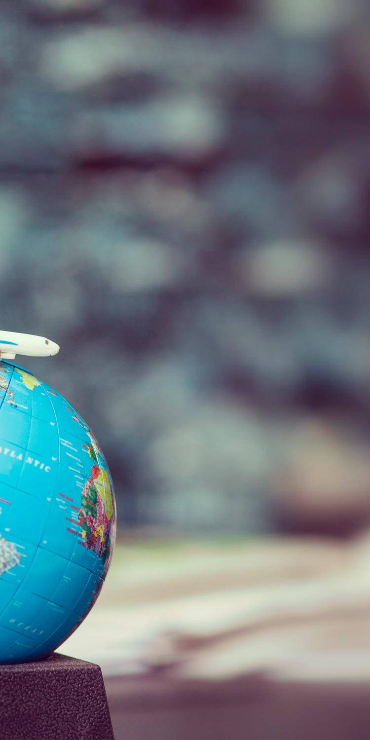 Small airplane on small globe