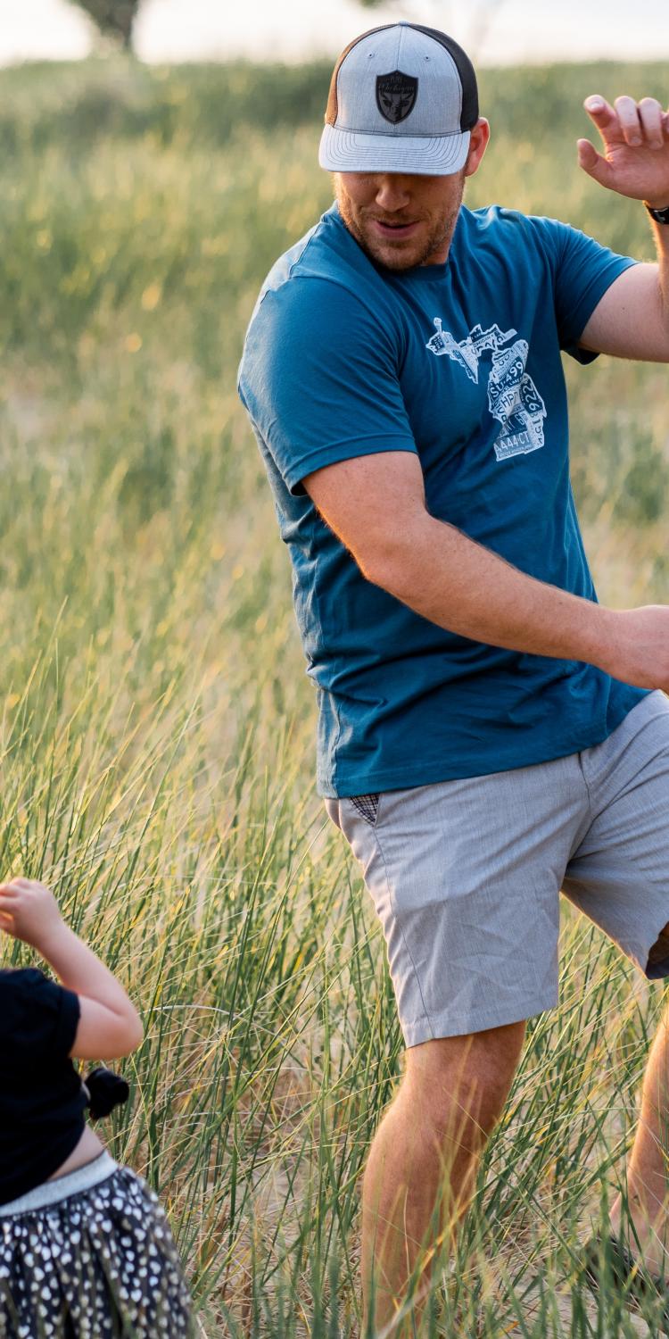 Man dancing with little girl