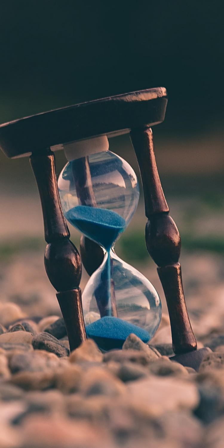 Hourglass on stones