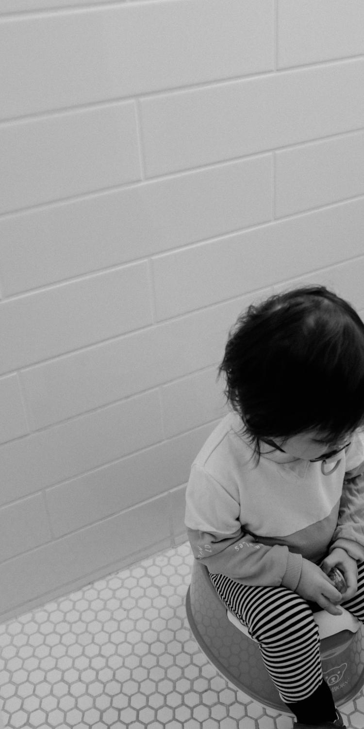 Child sitting on toilet
