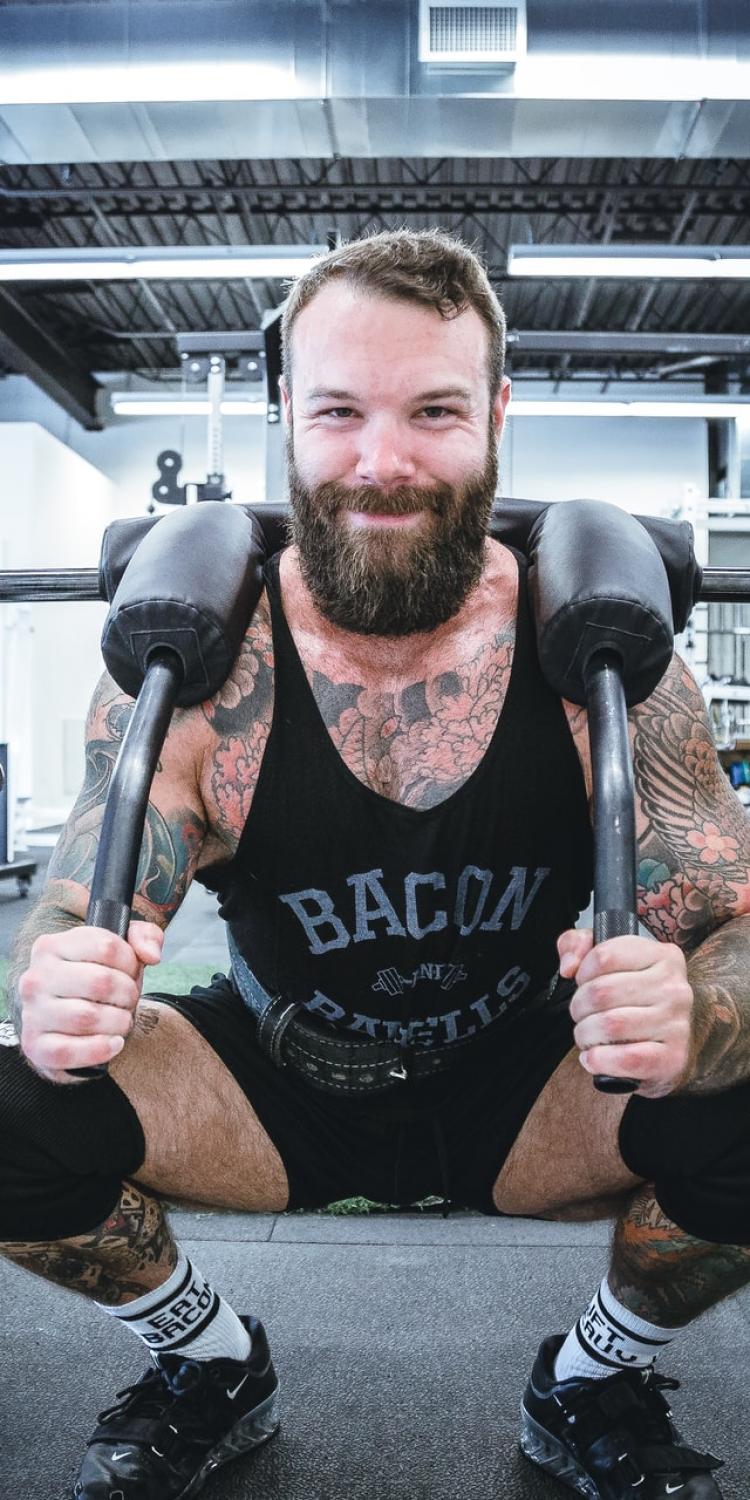 Man in weightlifting cage