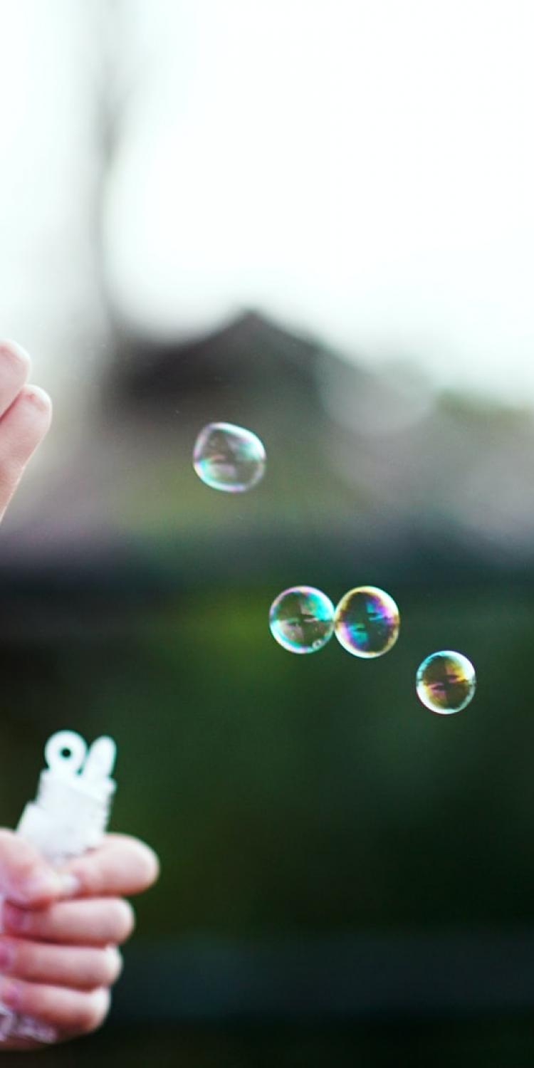 Boy blowing bubbles
