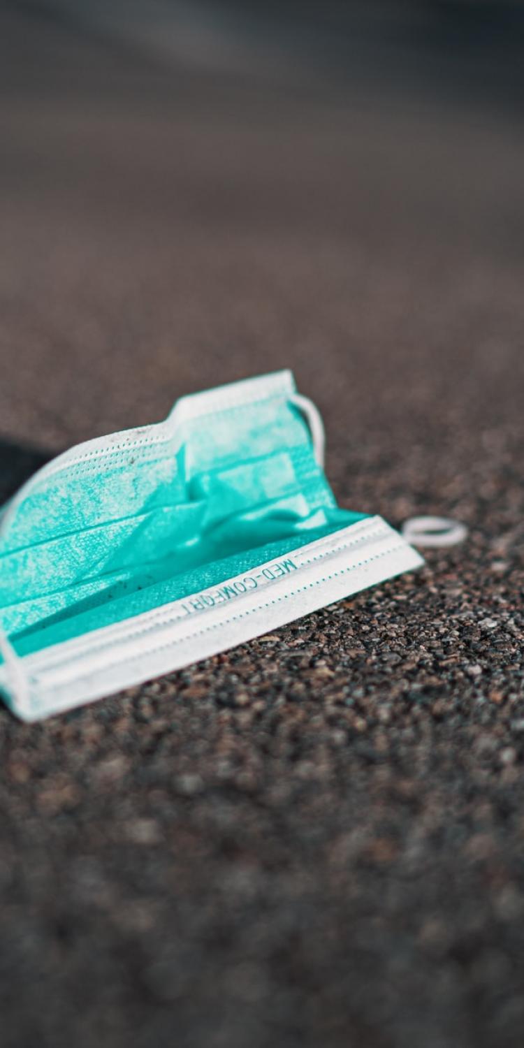 Medical mask on ground