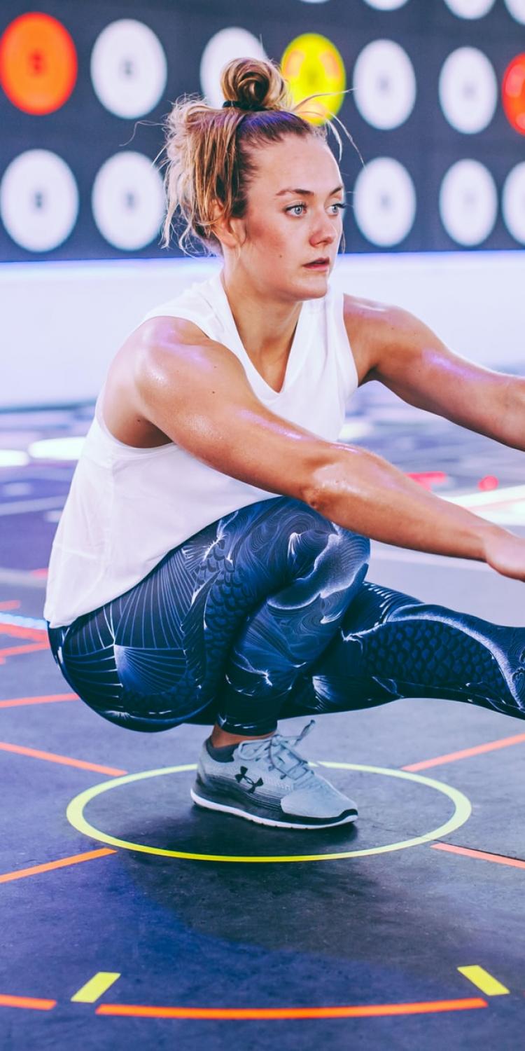 Woman doing single leg balancing squat