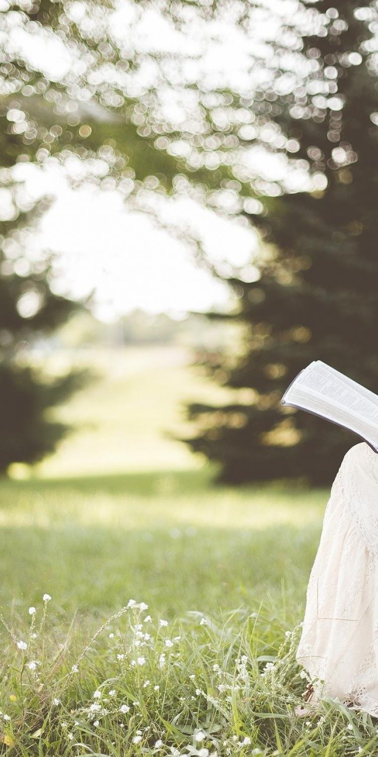 Woman reading outside