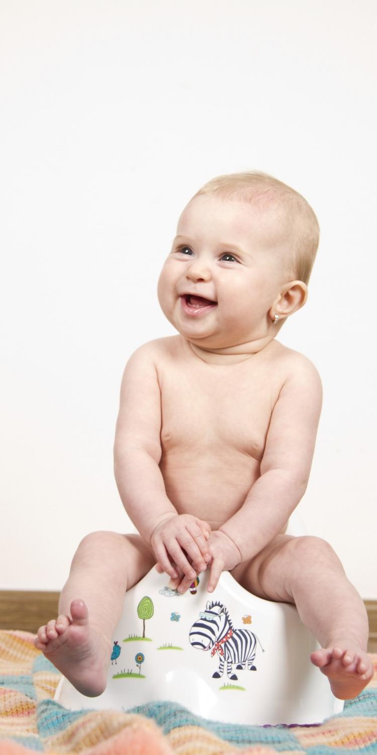 Child sitting on potty