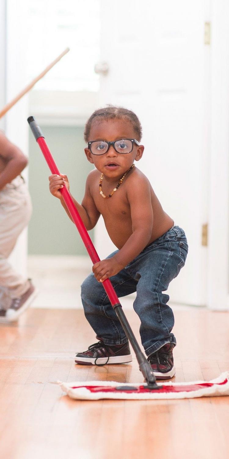 Boy mopping the floor