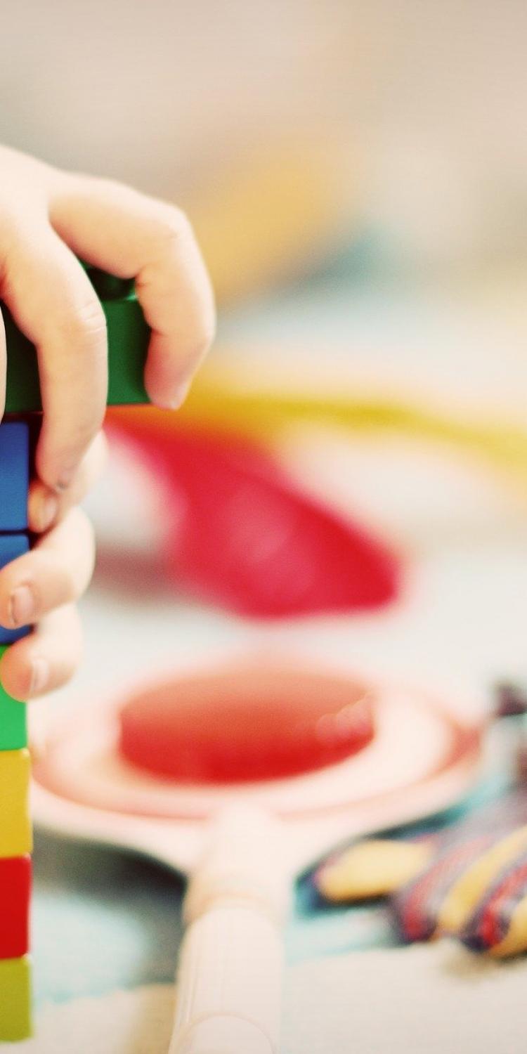 Child playing with LEGO