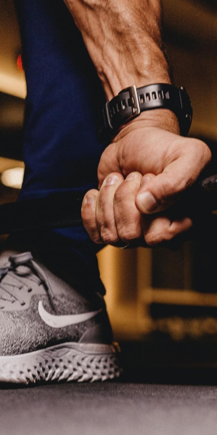 Person holding barbells