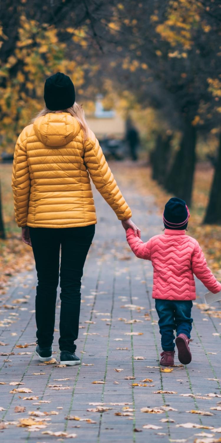Mother and daughter walking