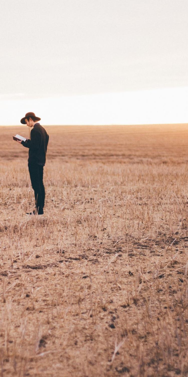 Man reading while standing