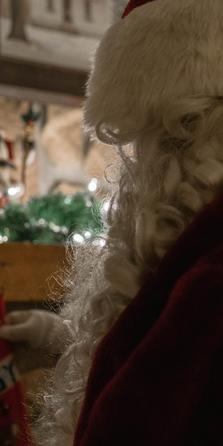 Santa Claus looking at a stocking