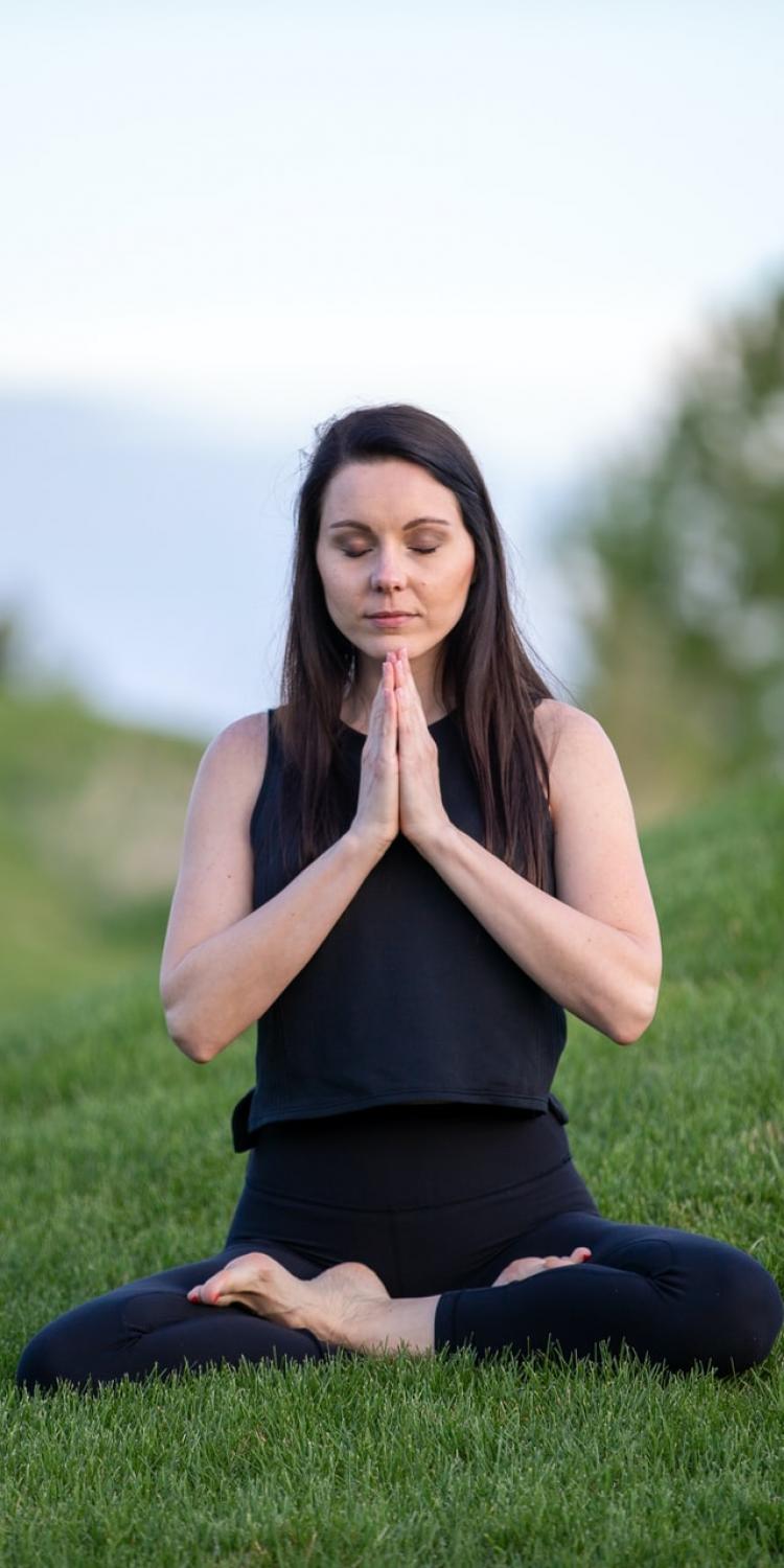Woman sitting in yoga pose