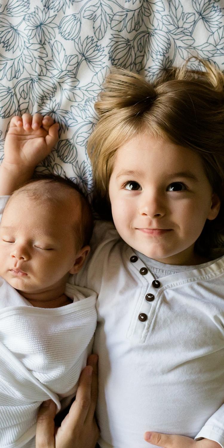 Baby and sibling together