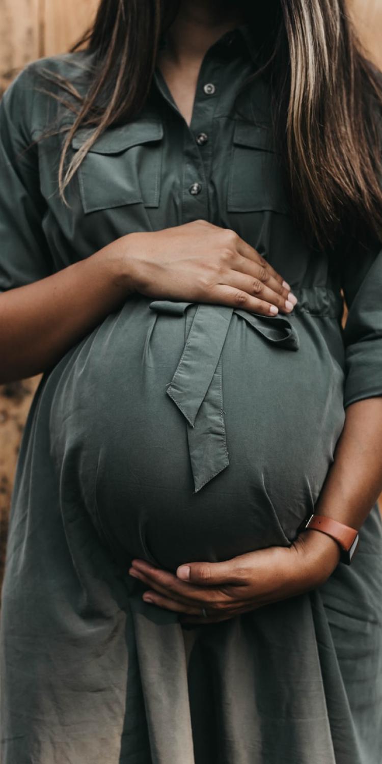 Pregnant women holding belly