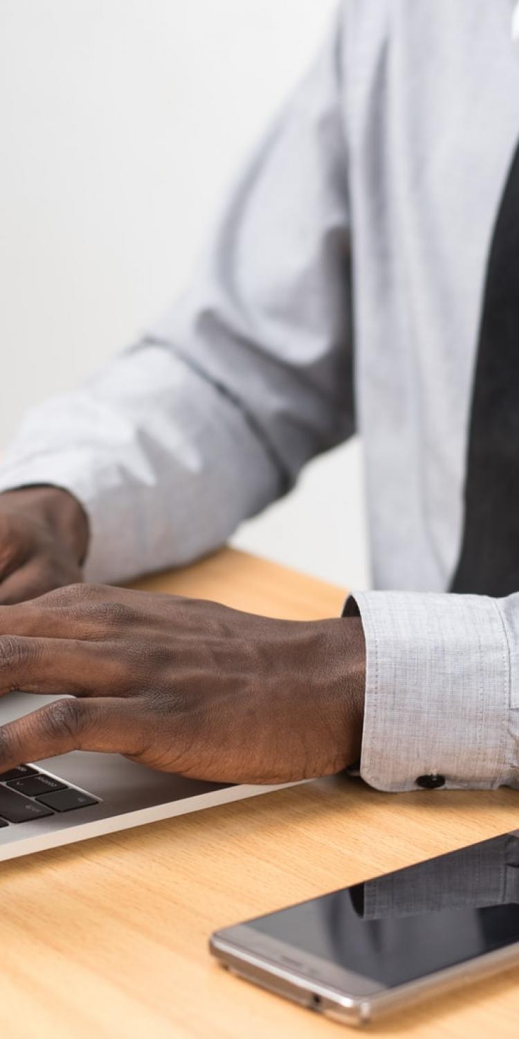 Person typing on computer