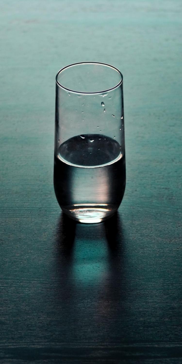 Clear drinking glass on table