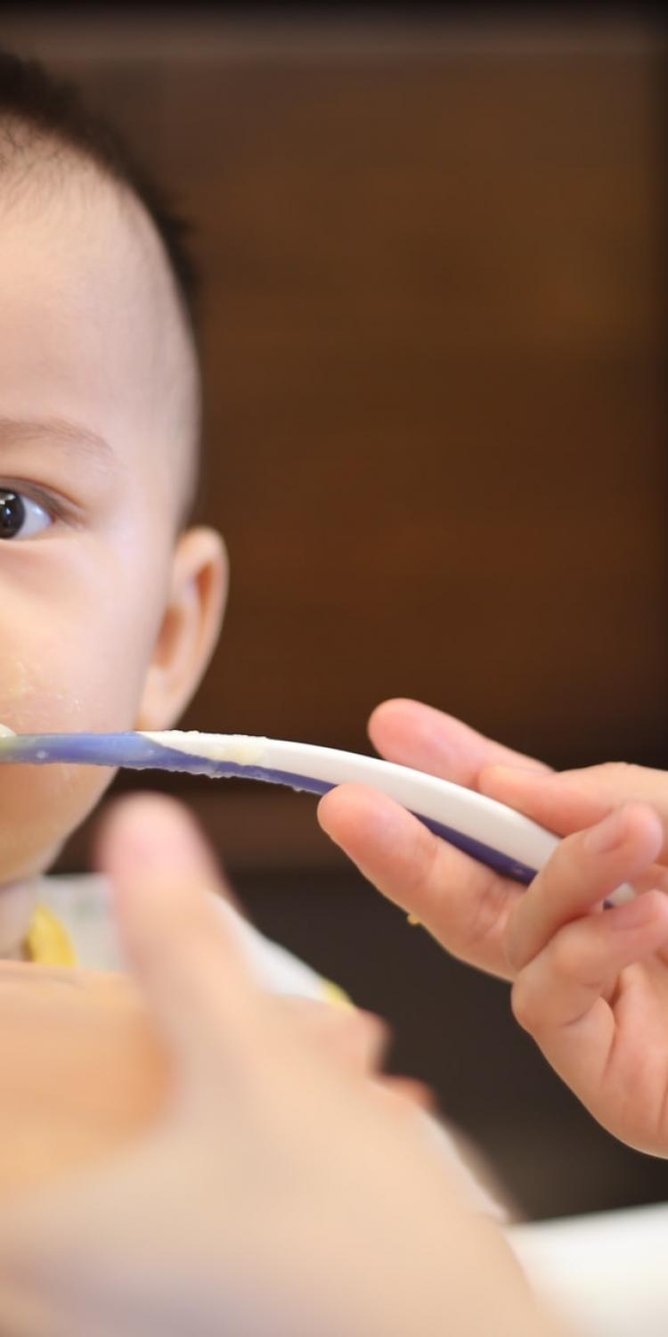 Baby eating baby food