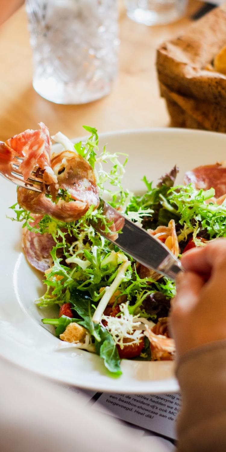 Person eating a salad