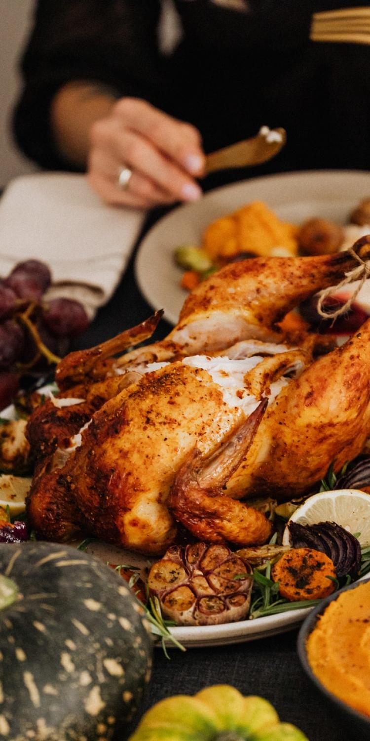 Roasted turkey surrounded by other food