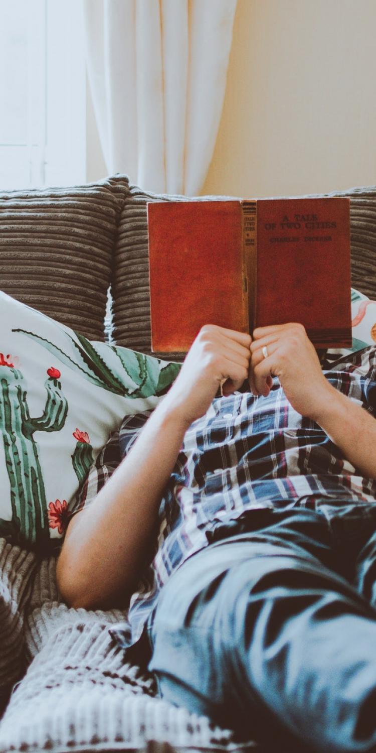 Man reading on couch