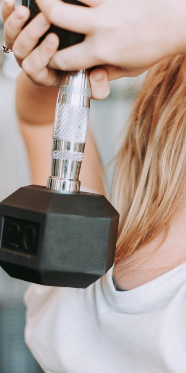 Woman lifting dumbbell