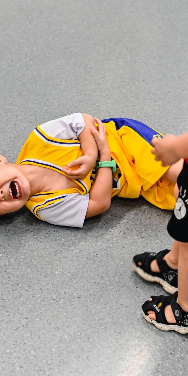 Child on floor crying