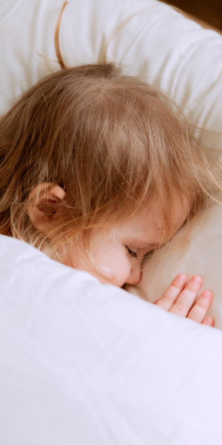 Child sleeping in bed