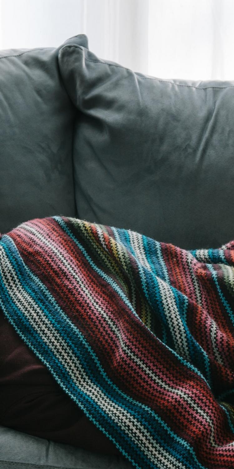 Person laying on couch