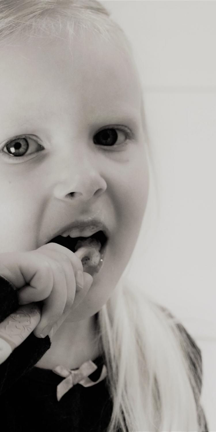 Girl brushing her teeth