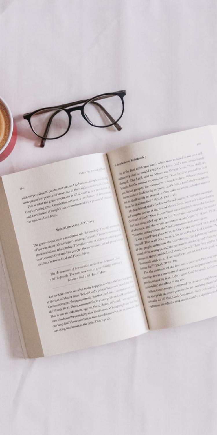 Open book next to coffee