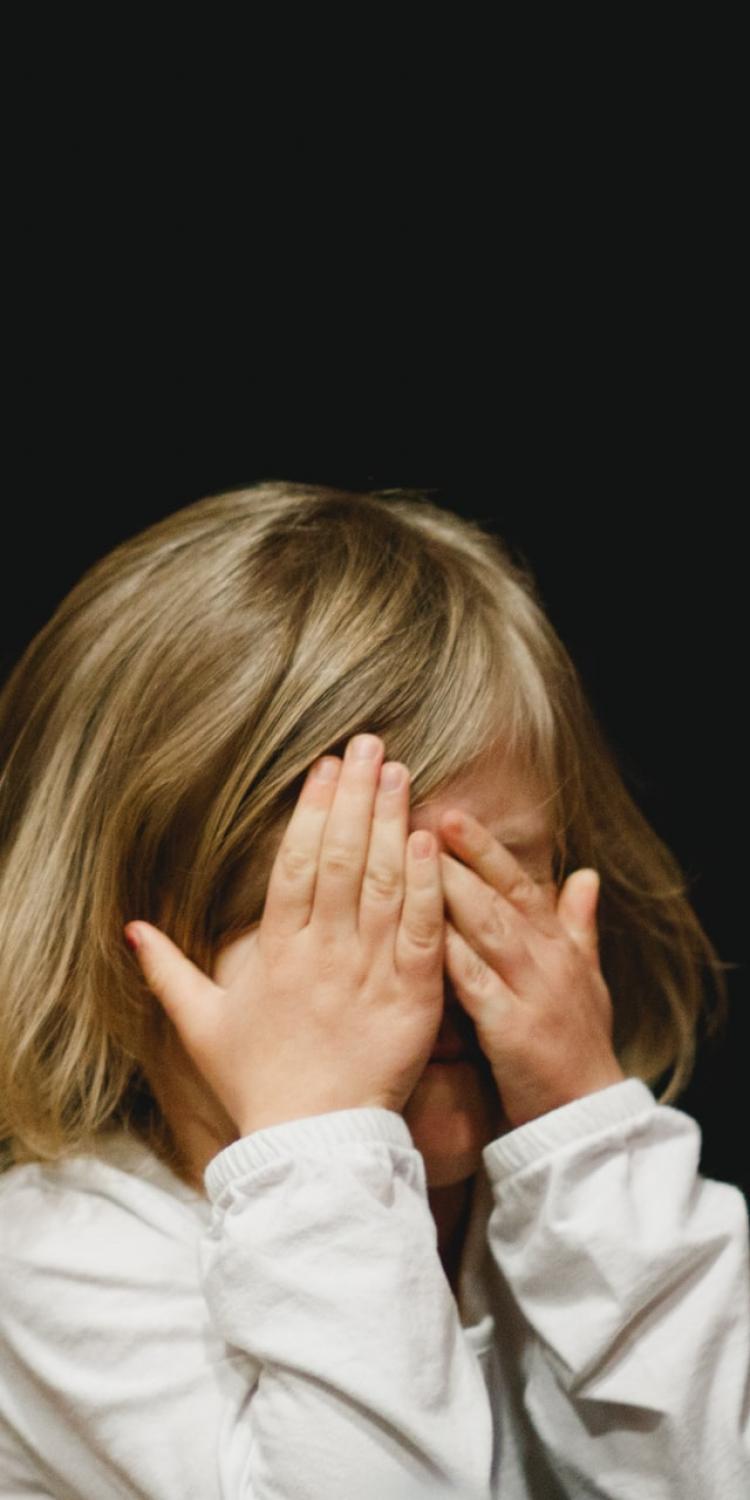 Child covering face