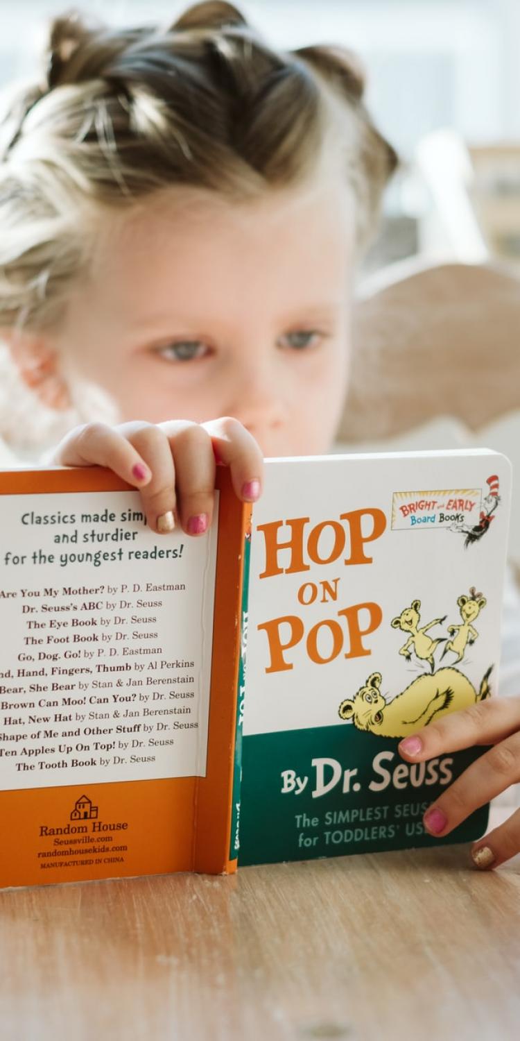 Girl reading Hop on Pop