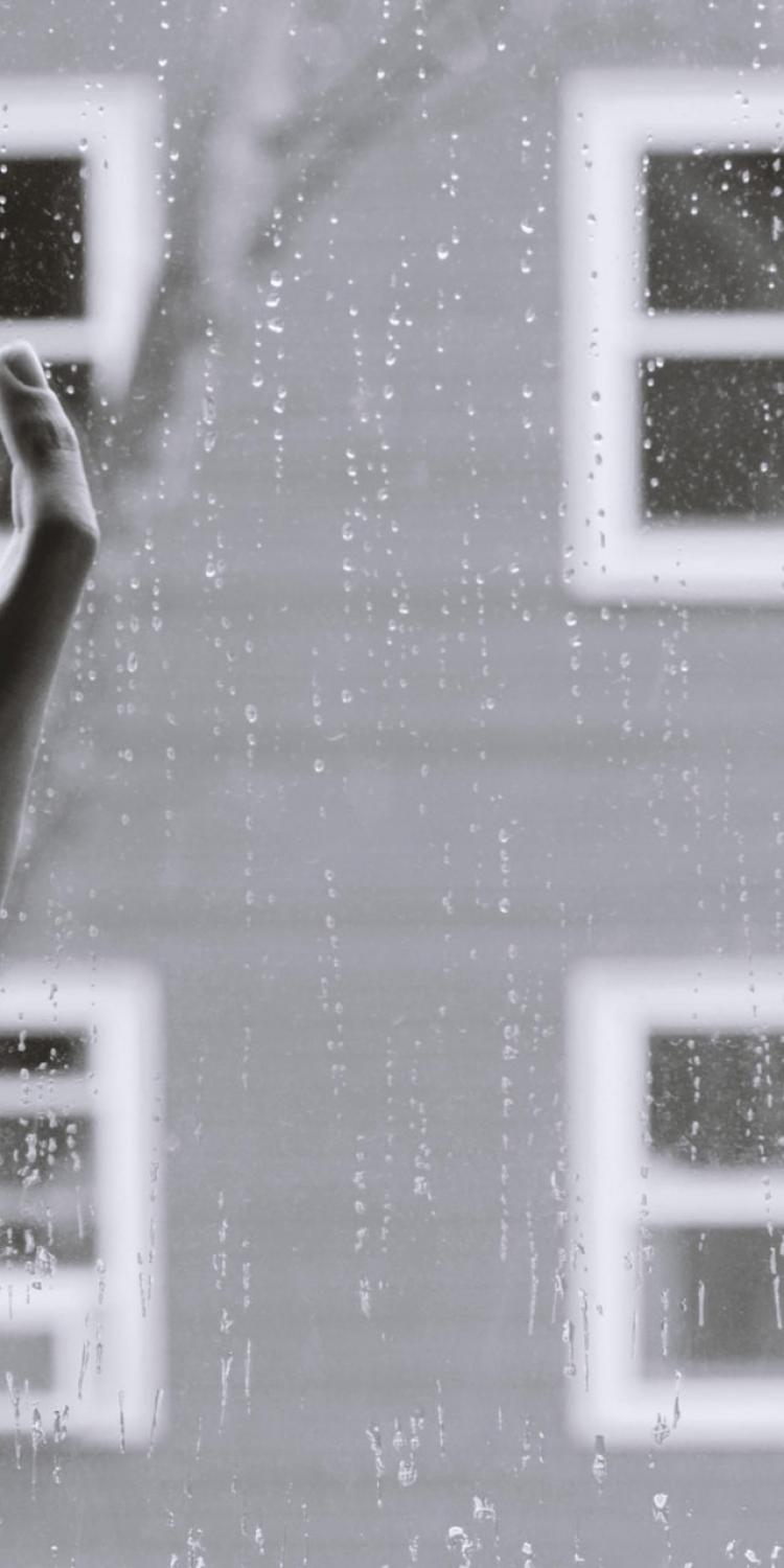 Woman's hand on window
