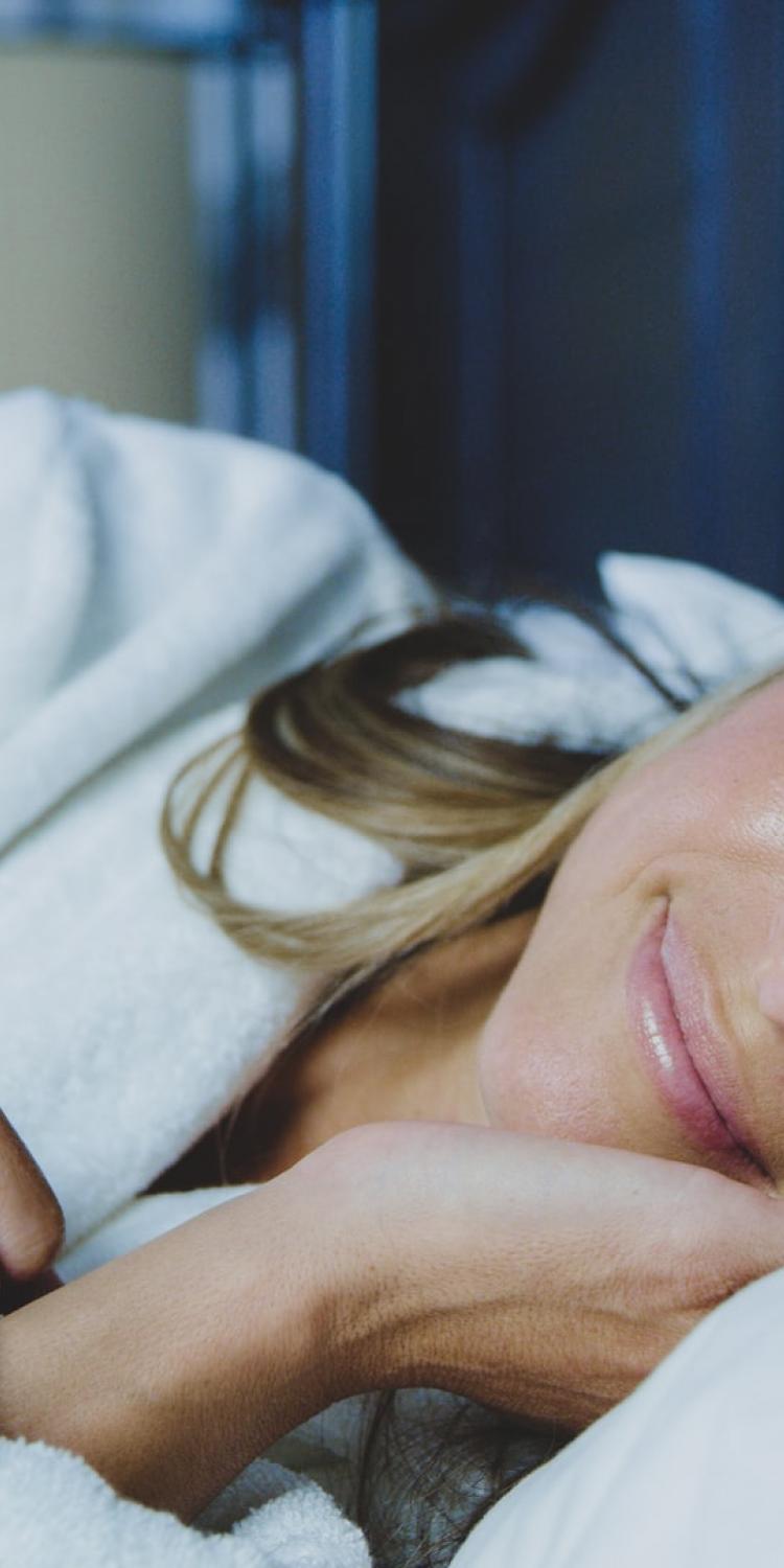 Woman lying in bed