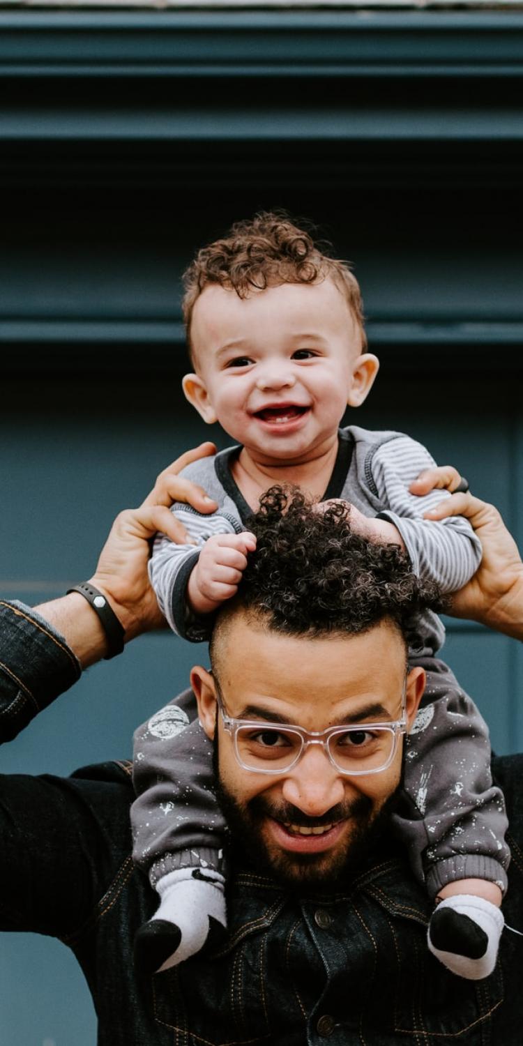 Father with child on shoulders