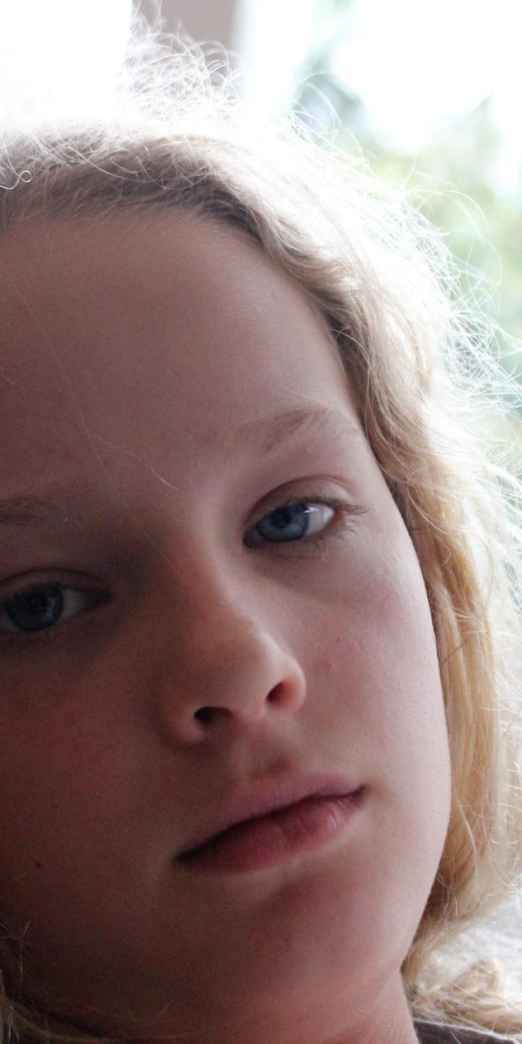 Sick child looking at camera