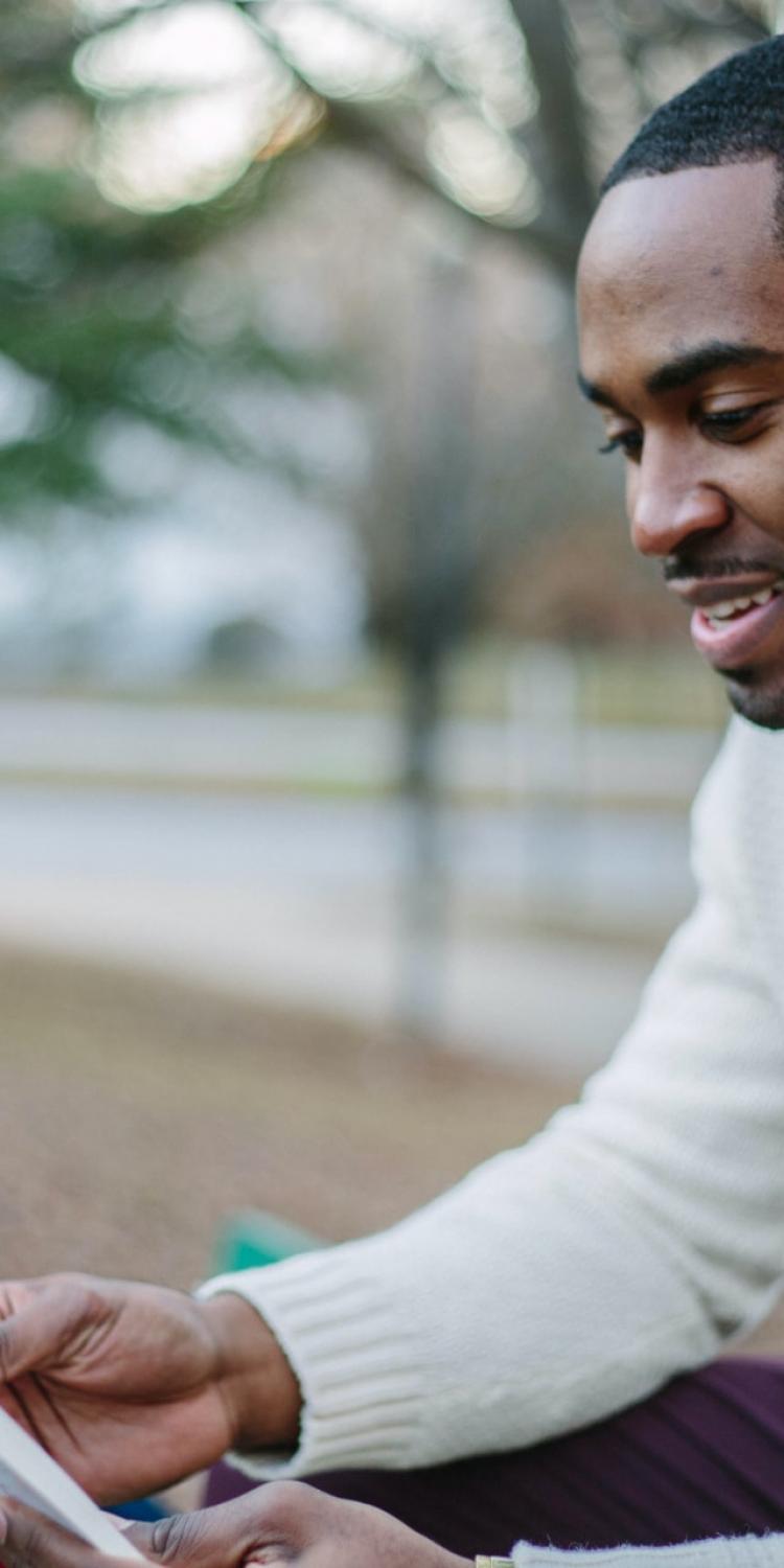 Man reading on a bench