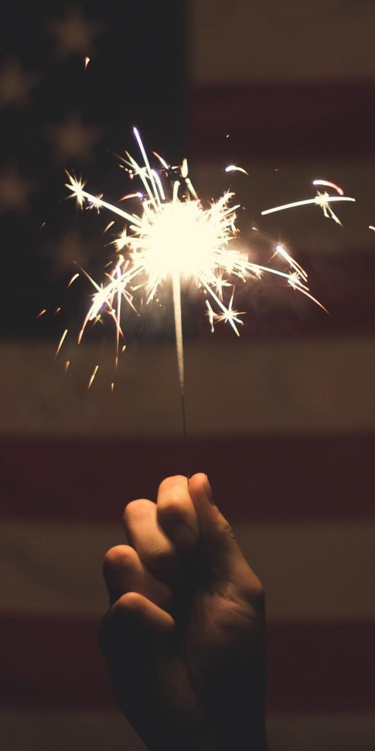 Sparkler in front of flag