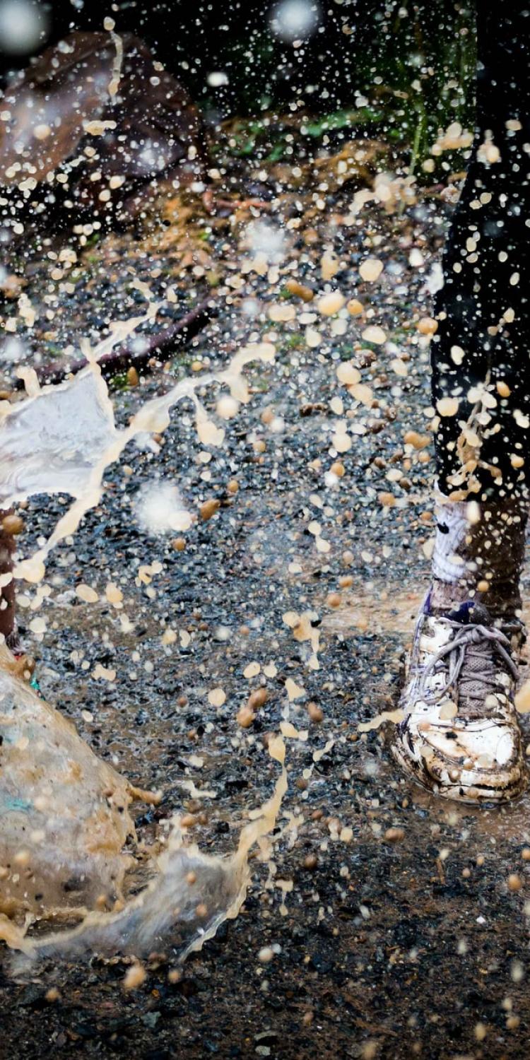 Kids jumping in puddles