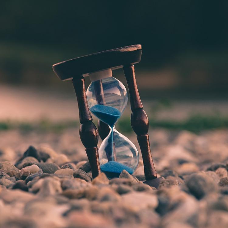 Hourglass on stones