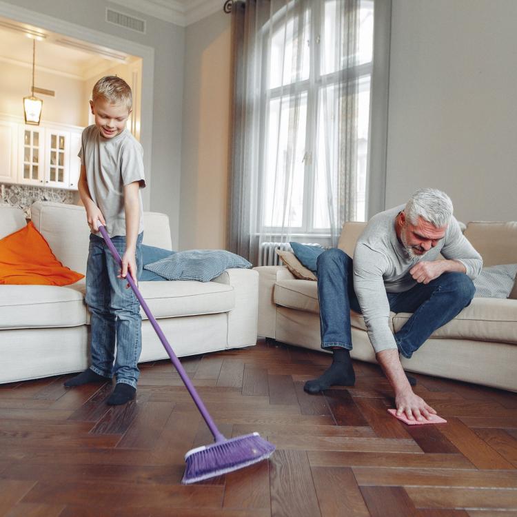 Photo of man and boy cleaning